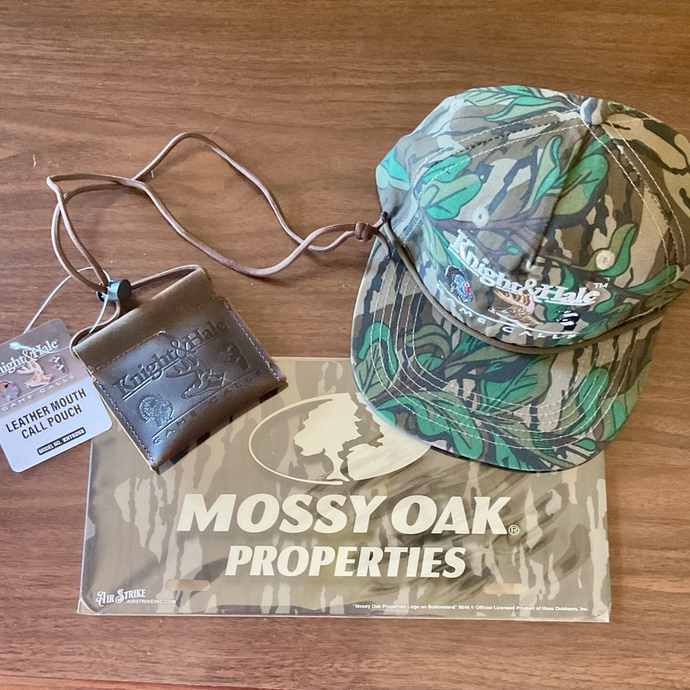 Mossy Oak Greenleaf cap w/ Knight Hale logo. Leather Call Pouch & license plate.